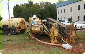 SyncGlobal's OSP crew laying cable in the ground.